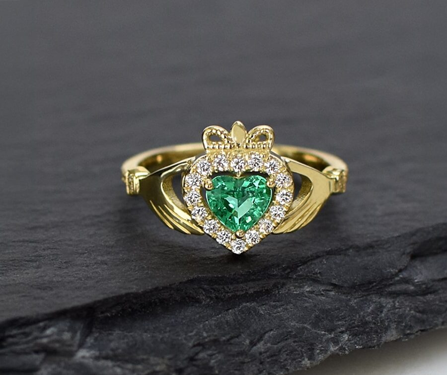 Heart-shaped emerald and diamond engagement ring in yellow gold, designed to suit individual lifestyles and personal style choices.