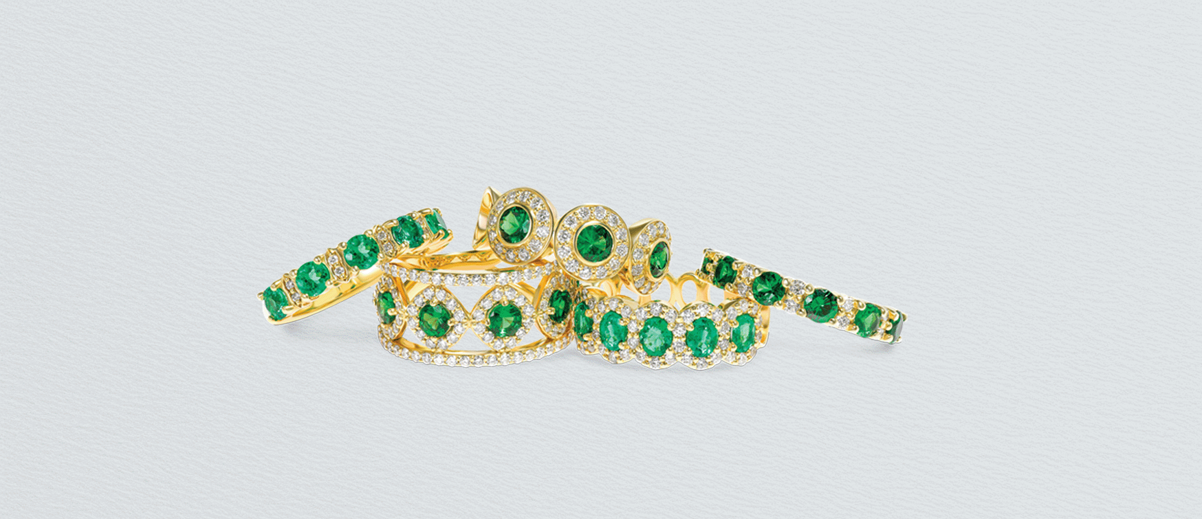 Tsavorite and Diamond Eternity Rings in Yellow Gold – Mark Solomon Jewellers