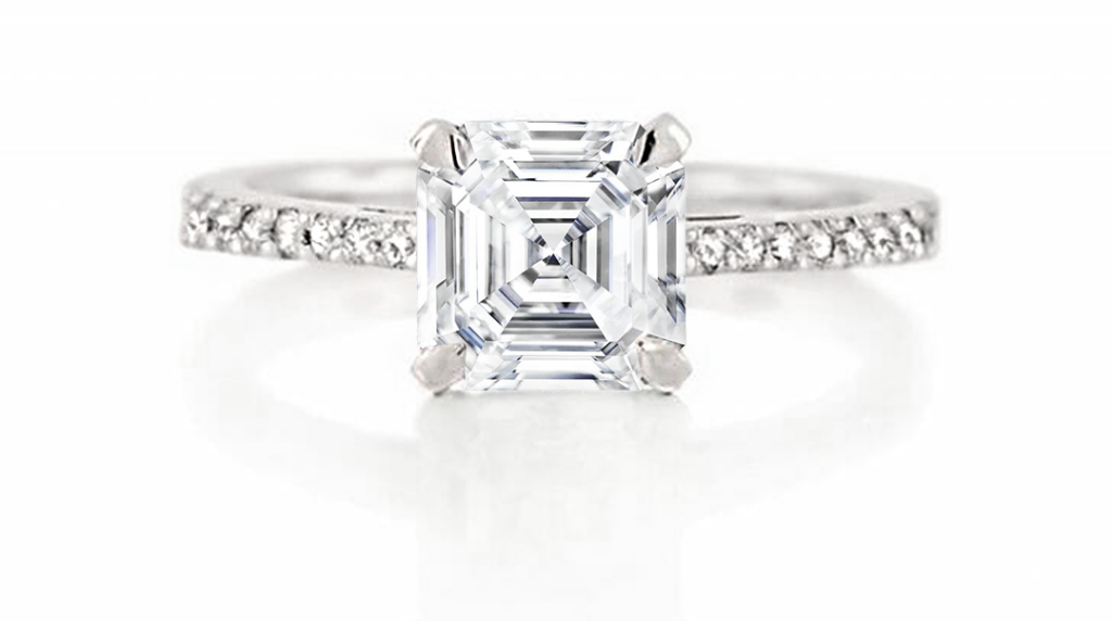 a Classic Asscher-cut Solitaire Diamond Engagement Ring. the Large Step-cut Diamond is Held by Four Claws and Set on a Delicate Band Adorned with Pave-set Diamonds in White Gold or Platinum.
