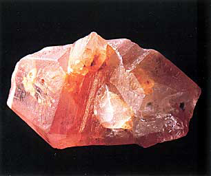 Pink Quartz Crystal Specimen with Translucent Facets on a Black Background