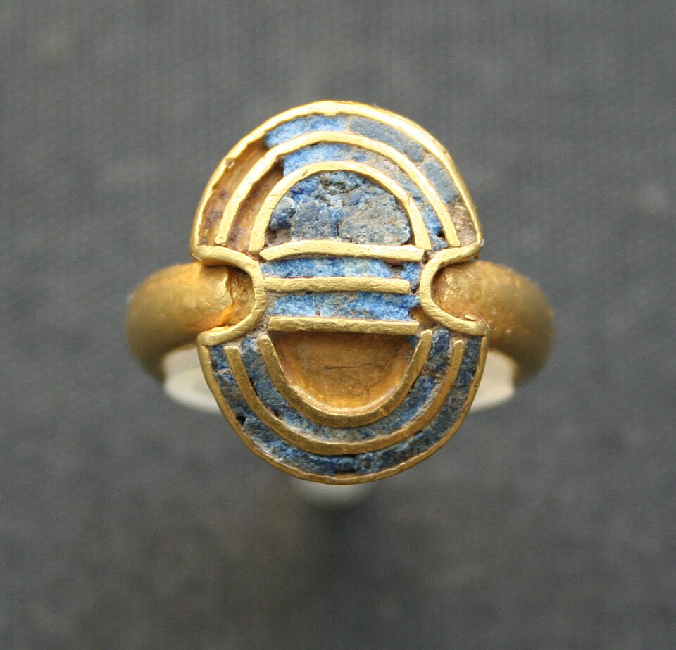 Antique Signet Ring with Blue Enamel and Gold Geometric Lines Forming an Abstract Shield Motif on Top of a Rounded Setting.