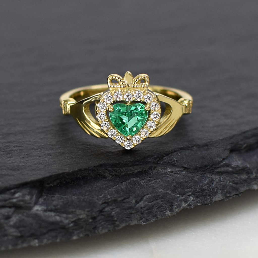 custom jewellery in Cape Town: An incredibly special ring, custom-designed as a meaningful gift, in honour of love, loyalty and friendship.

The unique design of the claddagh ring is a combination of three symbolic elements, with the heart representing love, the crown denoting loyalty, and the hands symbolising friendship.

Set with a luminous heart-shape emerald and glittering diamonds, this bespoke ring is a melding of Irish tradition, crafted in South Africa, with the emerald in its centre representing the Emerald Isle, Ireland’s other name. Steeped in symbolism, it is a gift of love, luck and remembrance, for a talented young woman on her way from Cape Town to a new life in Ireland.

A successful collaboration between client and designer, resulting in a piece that transcends time and distance.