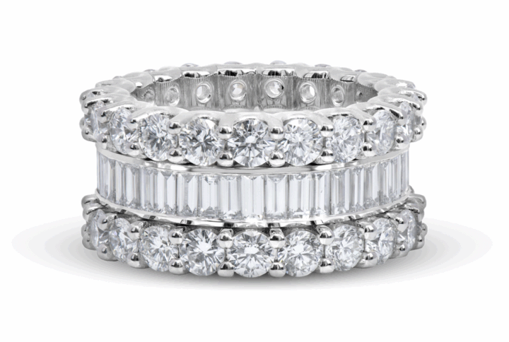 Fancy Platinum Eternity Band: with Round Brilliant Diamonds and One with Baguette Diamonds.