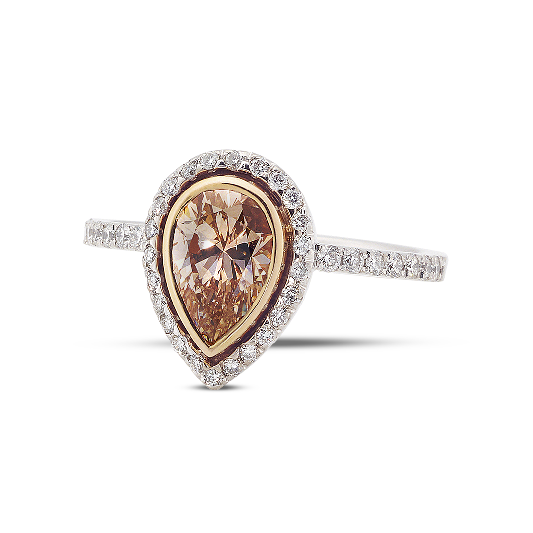 a Luxurious Pear-shaped Champagne or Brown Diamond Ring with a Double Halo. the Center Stone is Bezel-set in Yellow Gold, and the Outer Halo and Pave Band Are Set with White Diamonds in White Gold or Platinum.