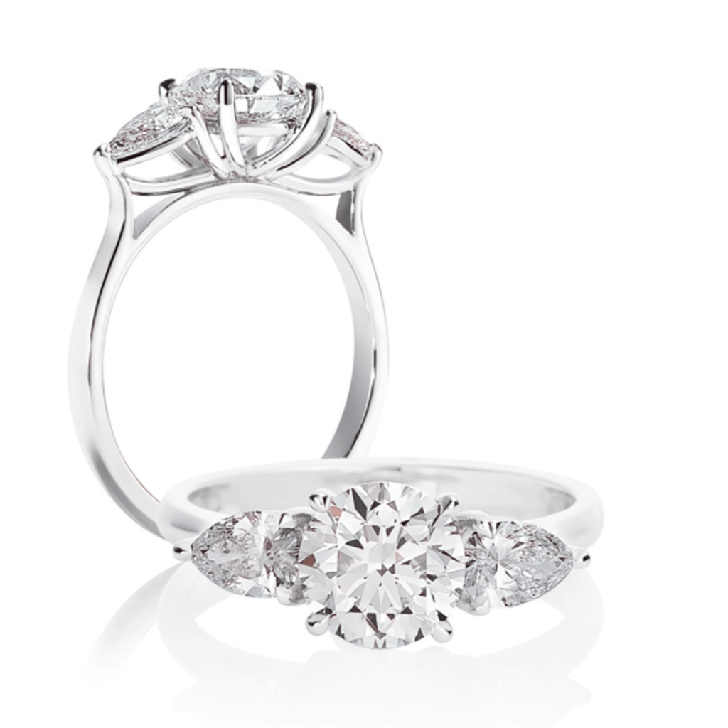 Platinum Three-stone Engagement Ring with Round Brilliant Cut Center Diamond Flanked by Marquise Cut Side Diamonds, Front and Side View.