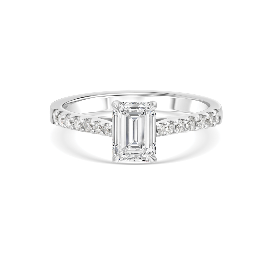 White Gold Ring with a Central Emerald-cut Diamond and Pave-set Diamonds on the Band.