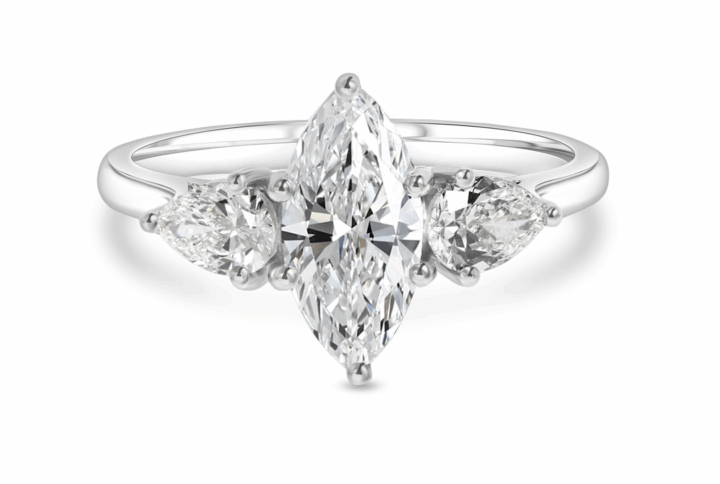 a Classic Three-stone Engagement Ring Featuring a Central Marquise-cut Diamond Flanked by Two Brilliant Pear-shaped Diamonds, Set in a Polished White Gold or Platinum Band.