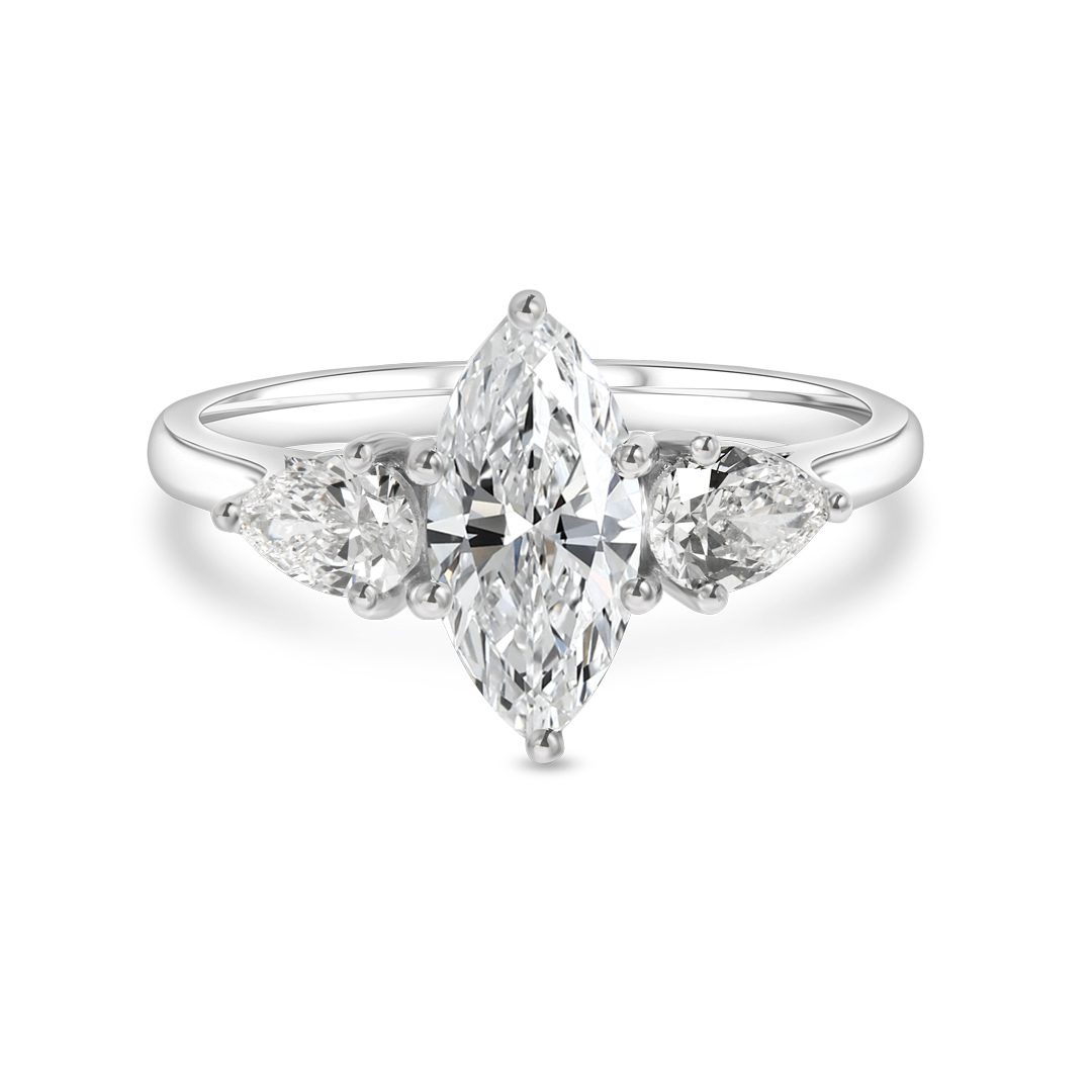 a Classic Three-stone Engagement Ring Featuring a Central Marquise-cut Diamond Flanked by Two Brilliant Pear-shaped Diamonds, Set in a Polished White Gold or Platinum Band.