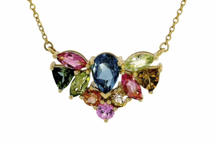 Yellow Gold Necklace with a Cluster of Various Colored Gemstones Including a Central Blue Topaz