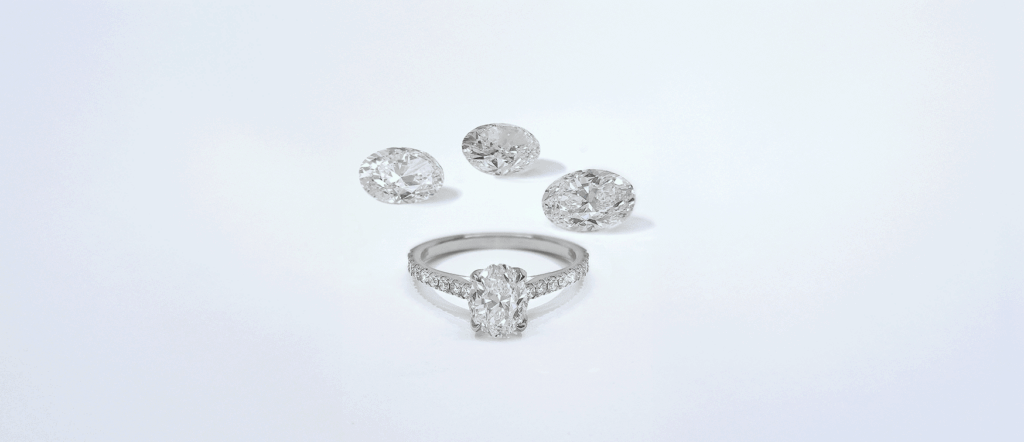 Oval Diamond Engagement Ring in White Gold Displayed with Three Loose Oval-cut Diamonds on a Clean, Light Background.