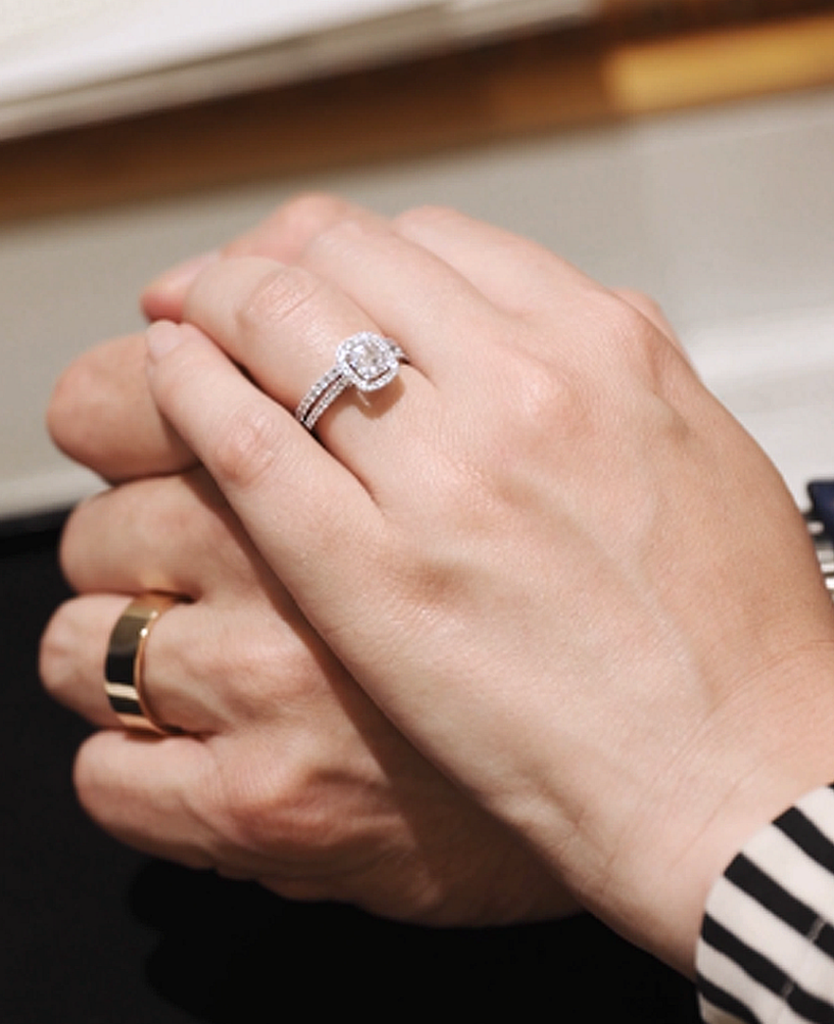 2022-05-07 Halo Ring and Eternity on Hand Holding Wedding Band Hand - Mark Solomon Jewellers